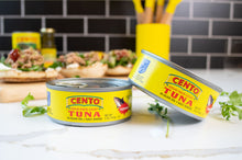 Two cans of Cento Tuna on a table with a blurred background thumbnail